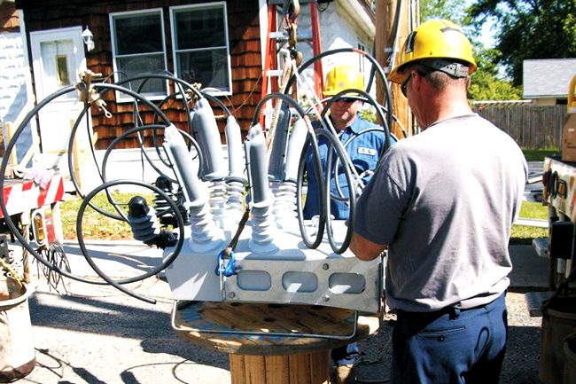Chicopee Electric Light Company engineers installing a NOJA Power OSM Recloser