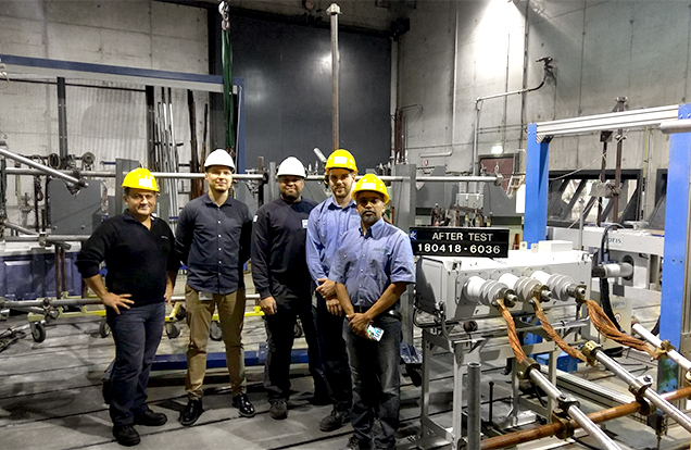 NOJA Power Staff at the KEMA Laboratory with the VISI-SWITCH® (right)
